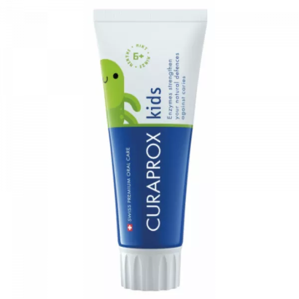 Tube of Curaprox Kids Mint Toothpaste with a friendly green cartoon whale, for natural caries protection, suitable for ages 6+